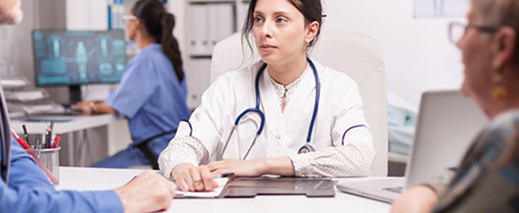 HCP sitting with patient looking across the table