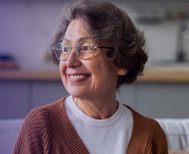 Elderly woman looking into the distance and smiling